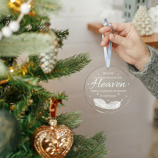 Acrylic feather ornament for remembering loved ones at Christmas.