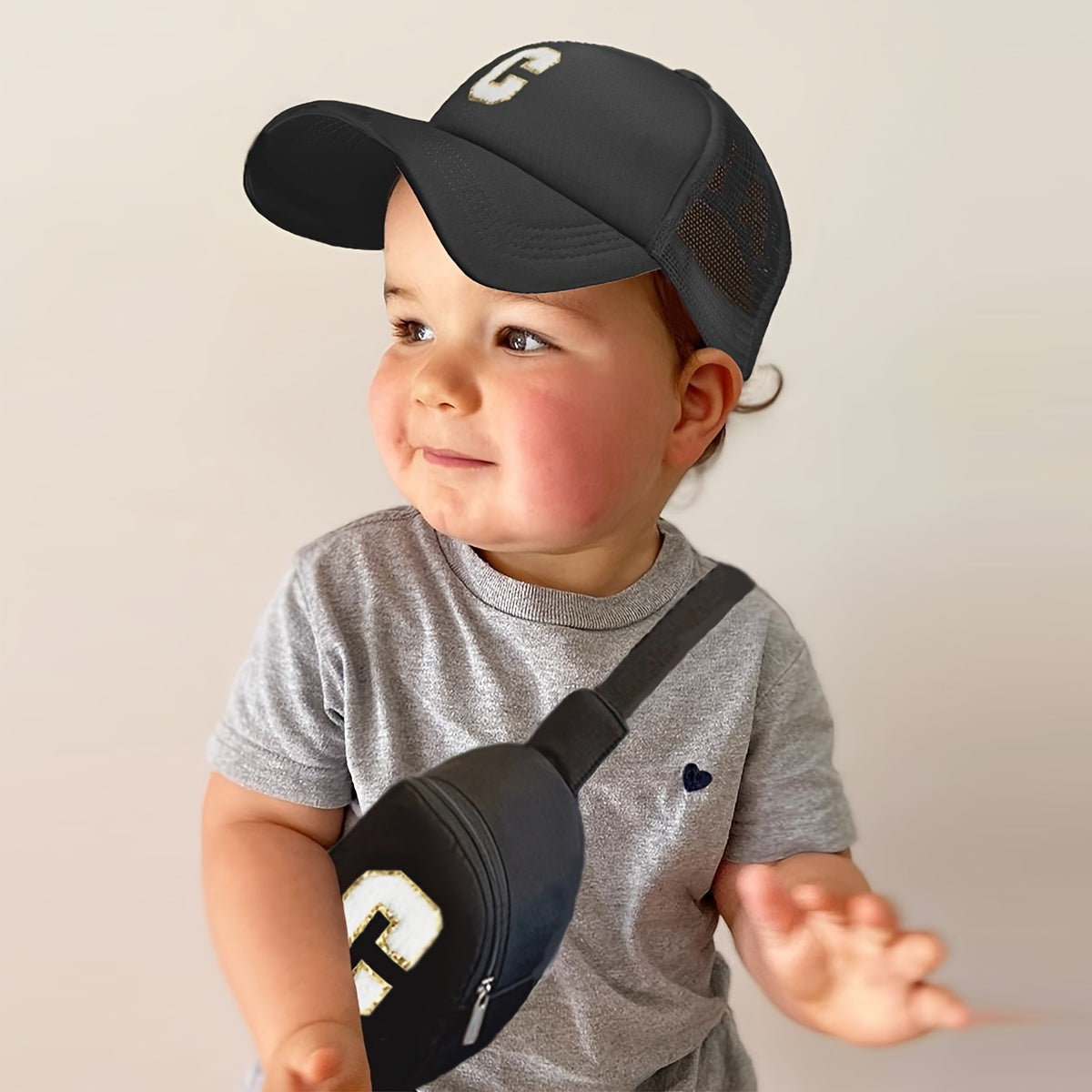 Children's Alphabet Baseball Cap and Shoulder Bag Set made of polyester material with a breathable, season-neutral design. Features a fitted cap with a buckle closure suitable for daily and