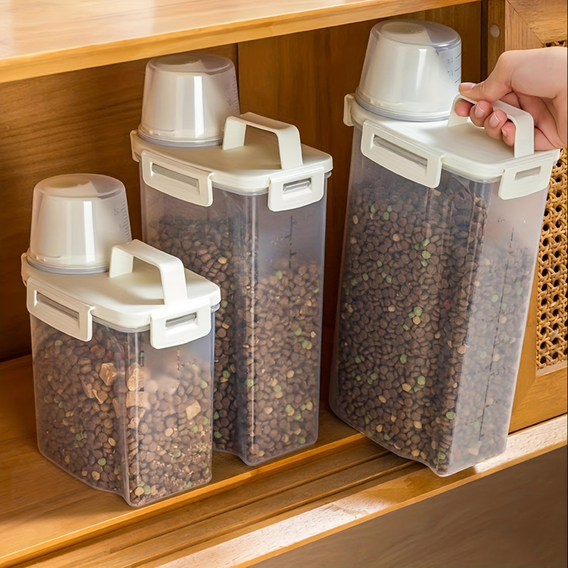 Pet food storage container with moisture-proof vacuum seal, measuring cup, and handle.