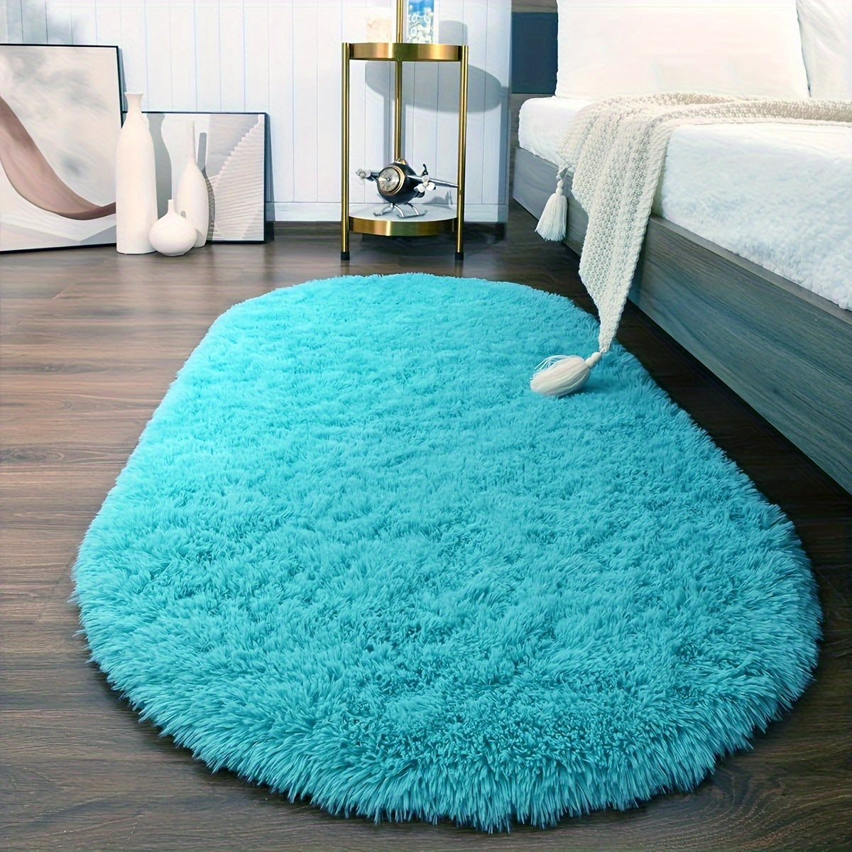 Soft and fluffy oval shaggy area rug, perfect for bedroom or living room. Made with skin-friendly thickened sponge and tufted polyester material. Durable and easy to maintain. Adds decorative touch to indoor spaces such as sofa, bedside, playroom, or