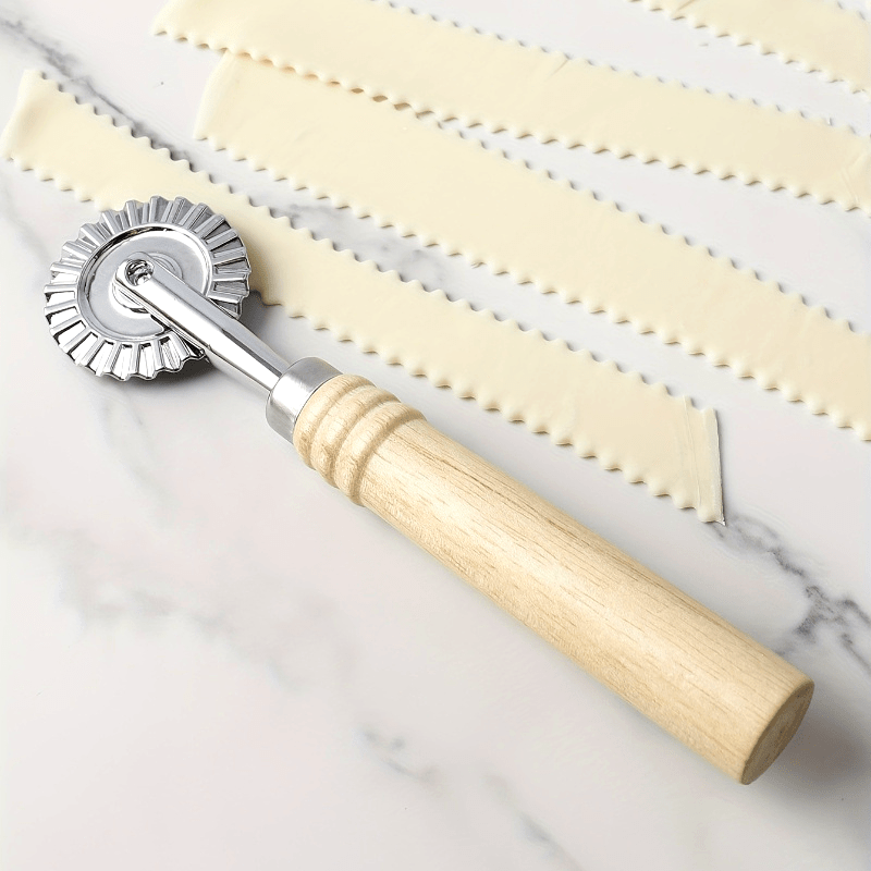 Premium pasta and ravioli cutter with long wooden handle, made of durable zinc alloy with a polished metal finish, safe for home kitchen use.