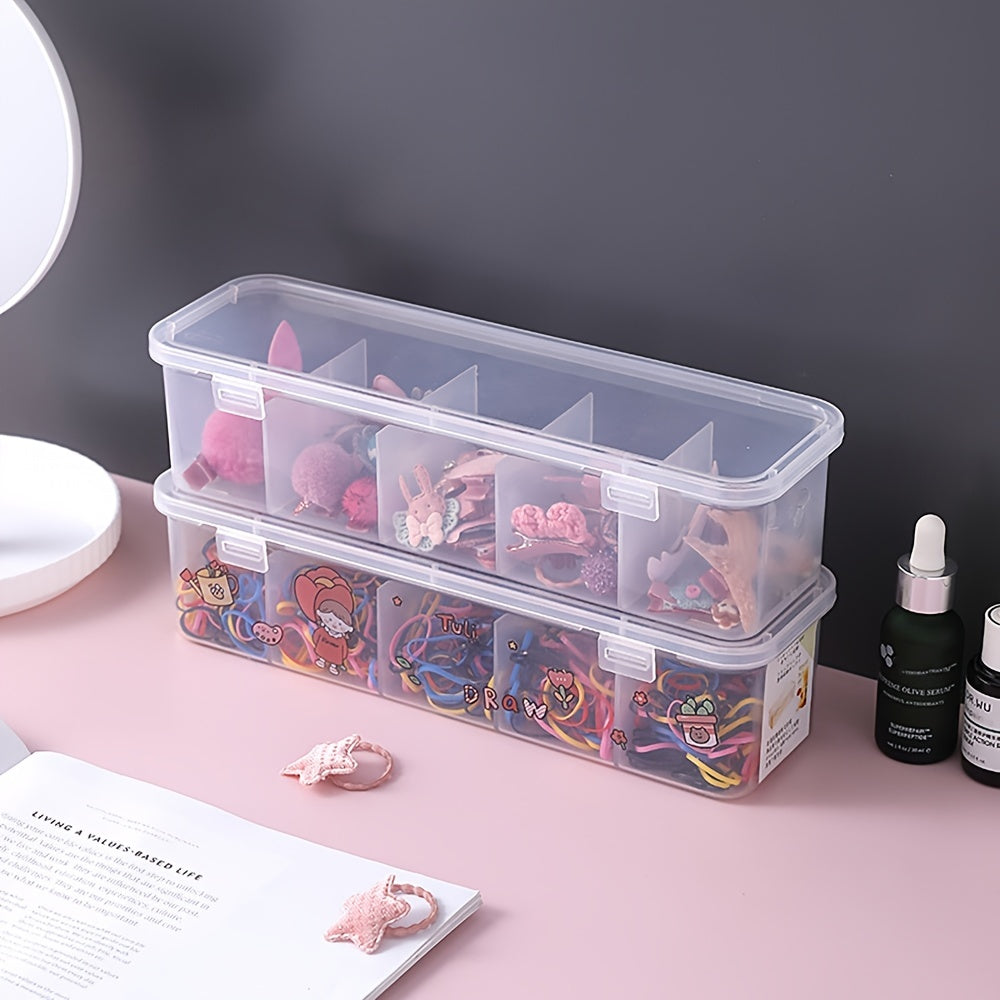 Durable clear plastic organizer box for hair accessories and jewelry with multiple compartments and secure lid.