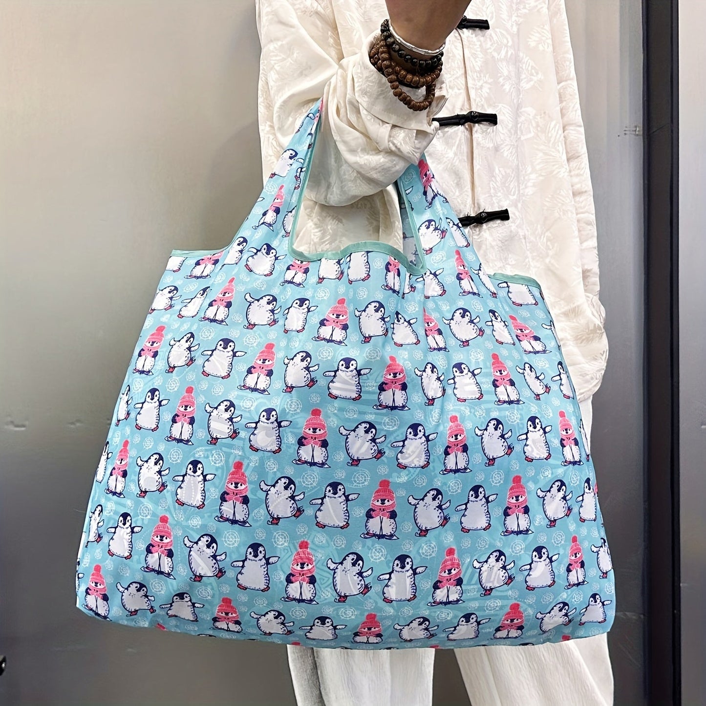 Durable and Lightweight Penguin Pattern Tote Bags - Perfect for Shopping, Groceries, and Everything in Between! These reusable and foldable totes are also recyclable, water resistant, and compact enough to fit in your pocket.