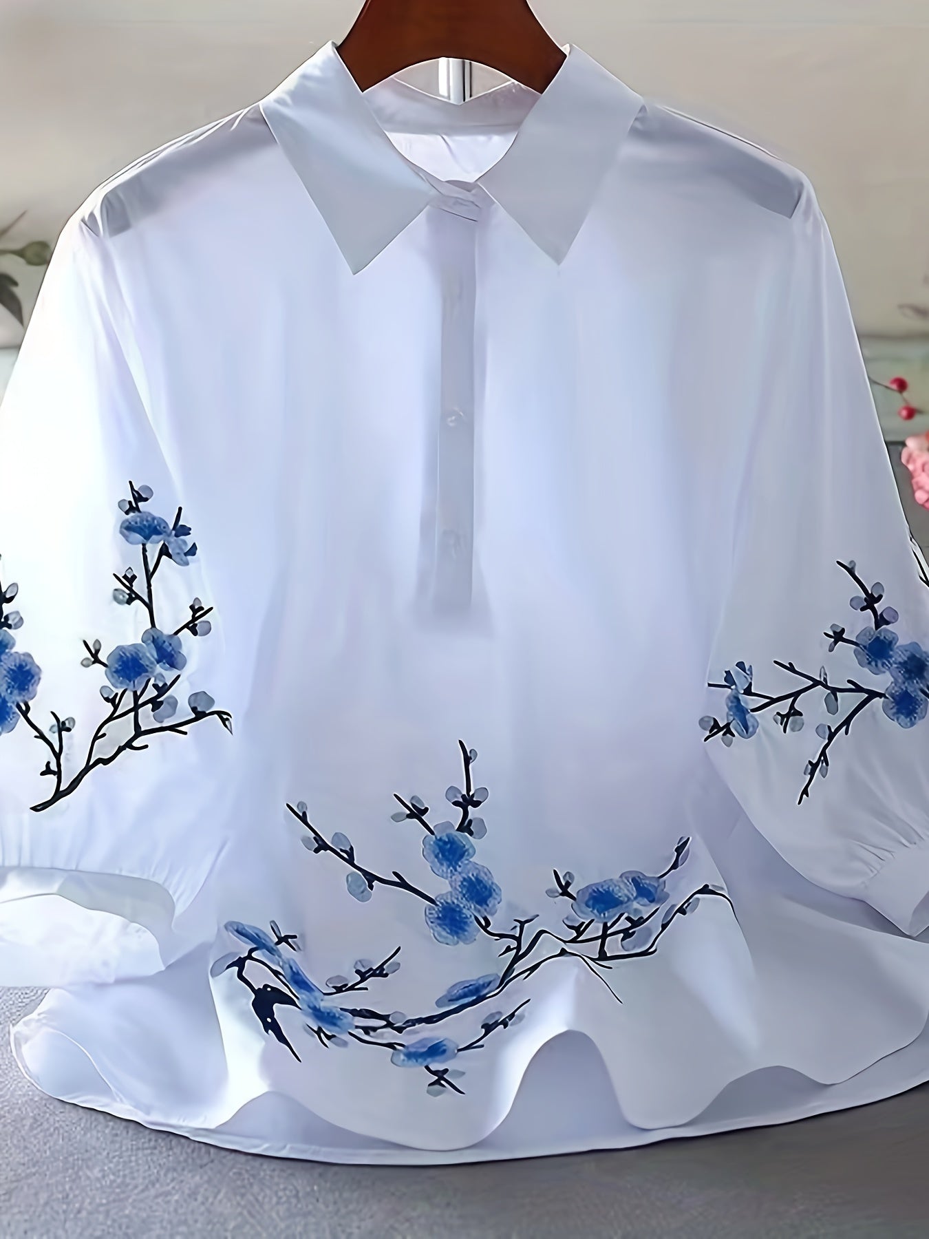 White floral embroidered shirt for women, made of polyester woven fabric with detailed embroidery and a collar design. Perfect for adult vacation style in spring/summer/autumn.