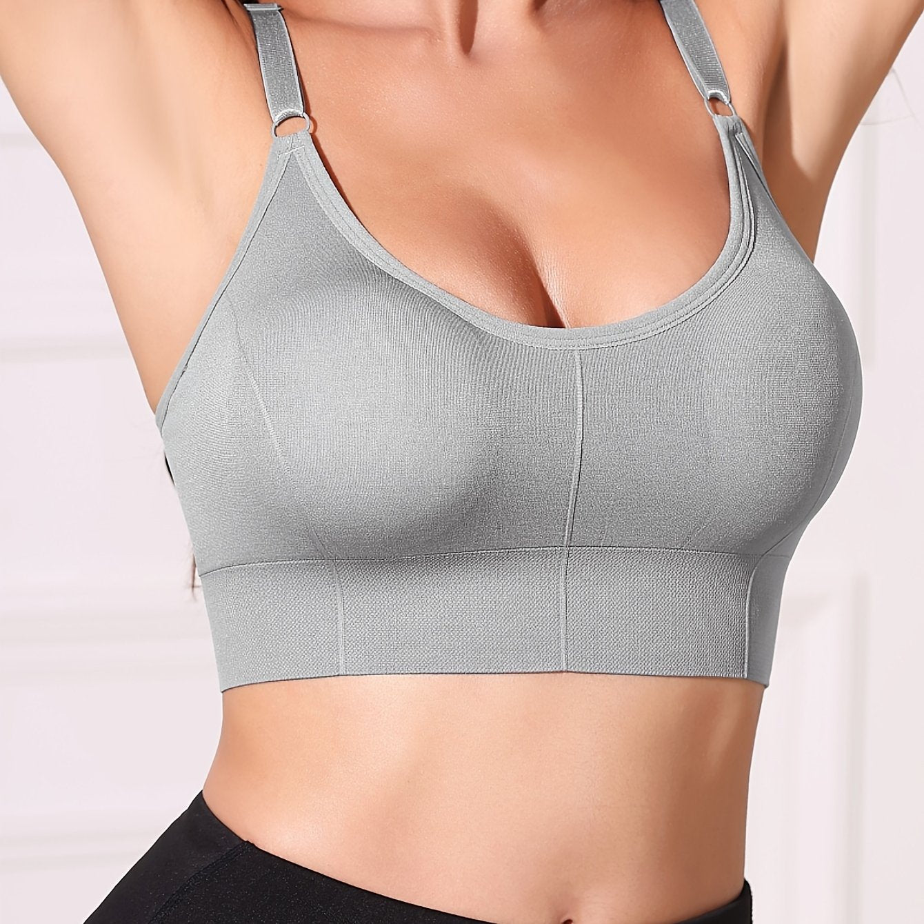 Gray wireless women's bra with removable pads, comfortable nylon blend, adjustable straps, backless design, and breathable fabric.