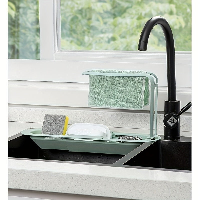 Durable plastic kitchen sink organizer with adjustable over sink dish drying rack and drainage basket. No assembly required for convenient storage of sponge, soap, and cloths. Multi-functional design.