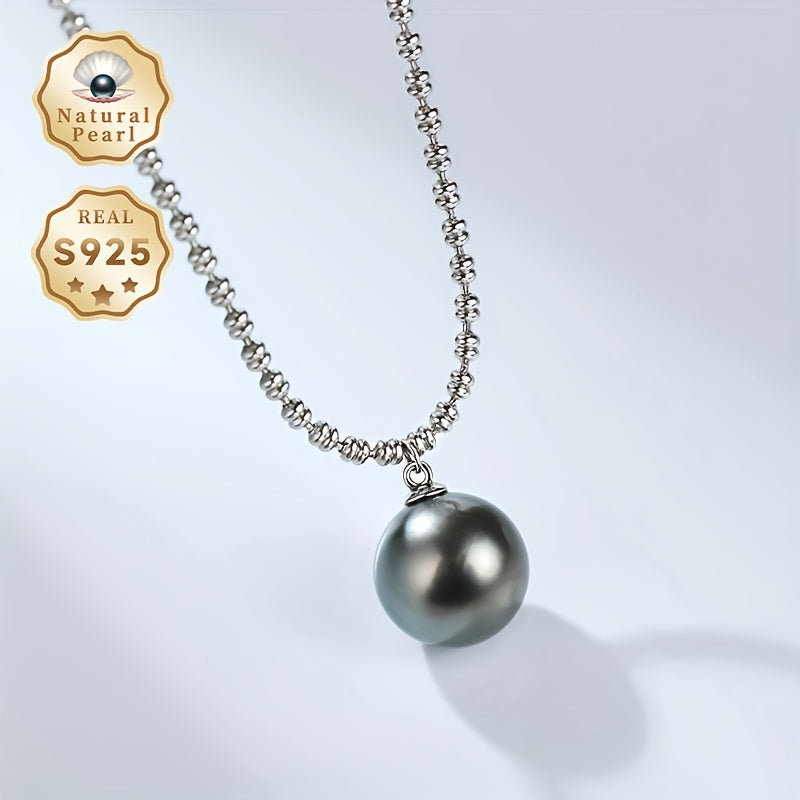 Elegant Vintage-Inspired Black Pearl Pendant Necklace for Women - Featuring Large 10-11mm Round Sea Pearls on an S925 Silver Chain. Perfect June Birthstone Gift presented in a Luxury Red Gift Box. Inspired by Polynesian design, showcasing the Natural