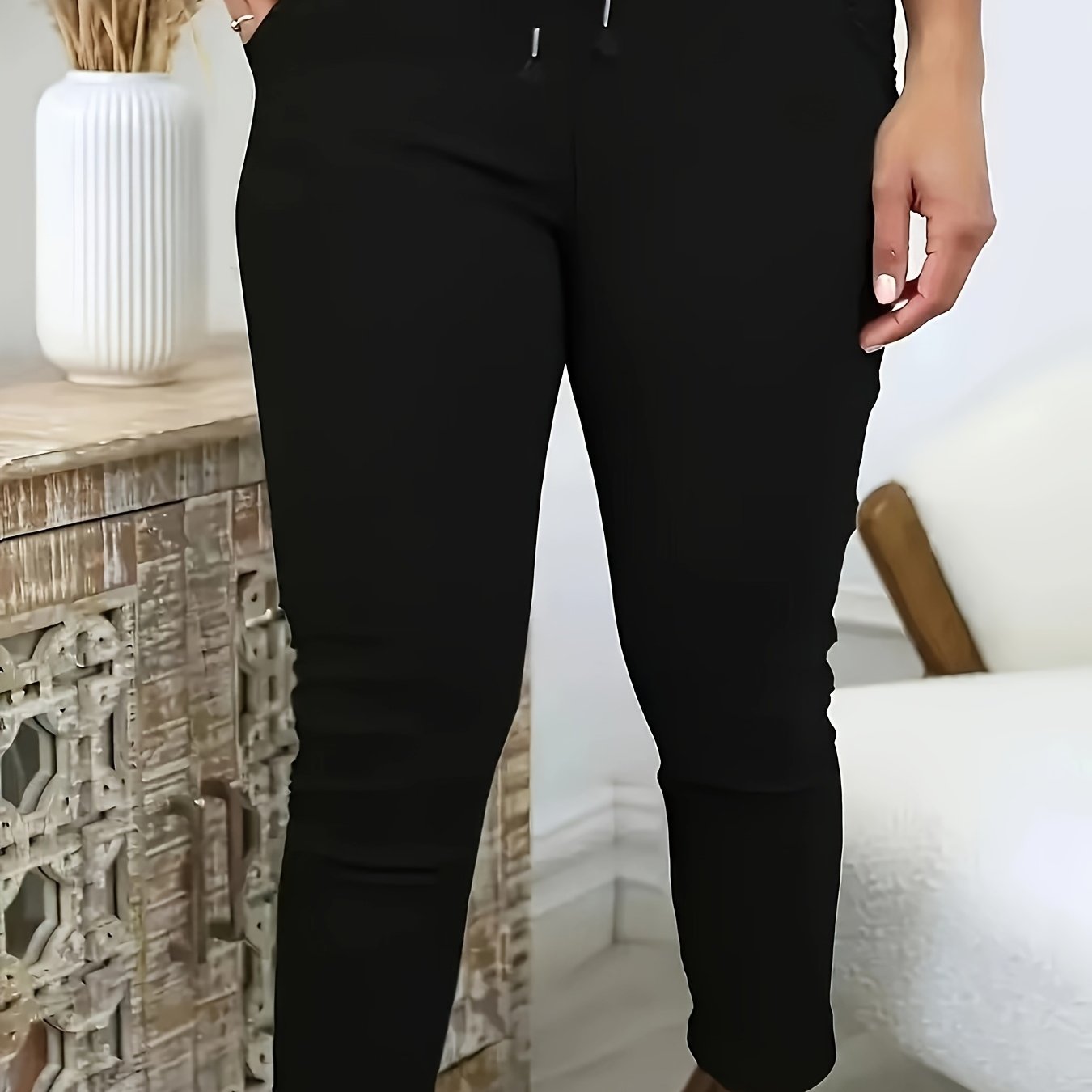 Machine-washable plus-size skinny pants in solid color polyester knit with medium stretch, elastic drawstring waist, and front pockets.