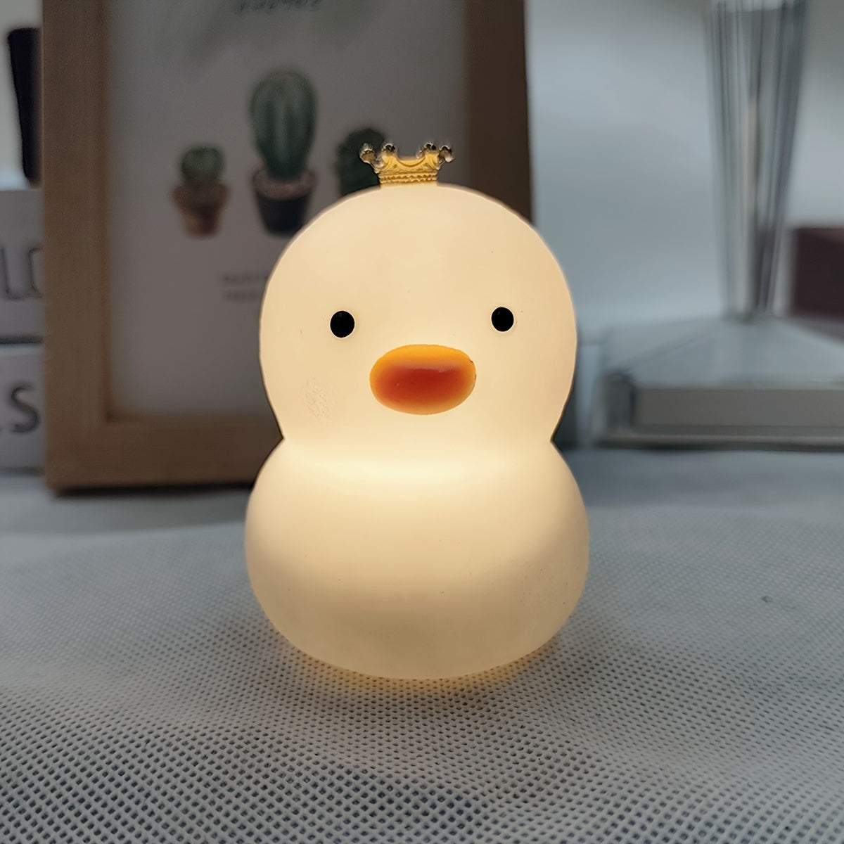 Duck-shaped LED night light, cute and fashionable, battery-powered with glossy finish. Perfect for bedroom decor and gift-giving for holidays, birthdays, or Christmas.