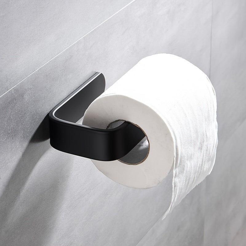 Self-adhesive wall-mounted toilet paper holder for home bathrooms.