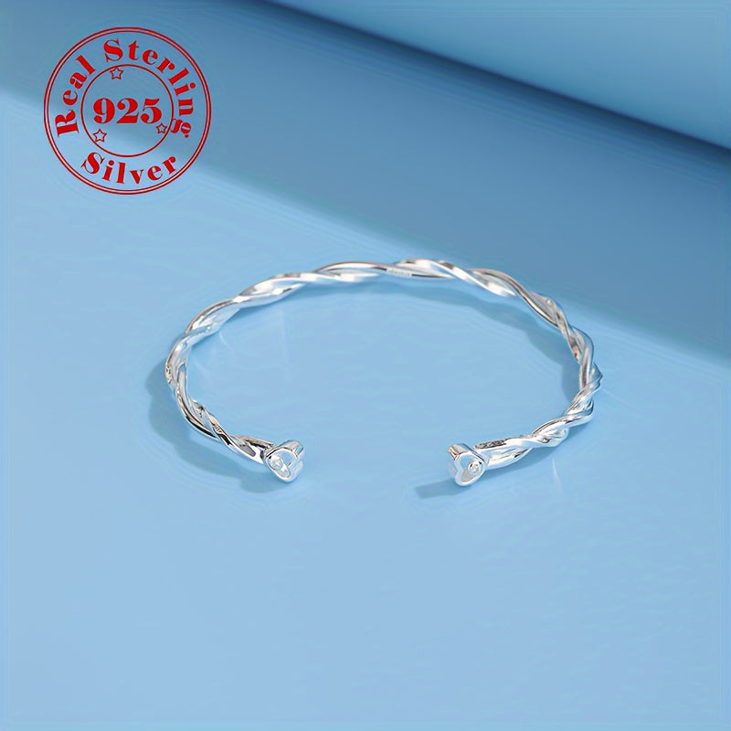 Elegant and simple twisted Möbius band bracelet for women, made of 925 sterling silver with white golden plating. This adjustable open cuff features synthetic zirconia and is hypoallergenic, weighing 9g. Perfect for daily wear or gifting.