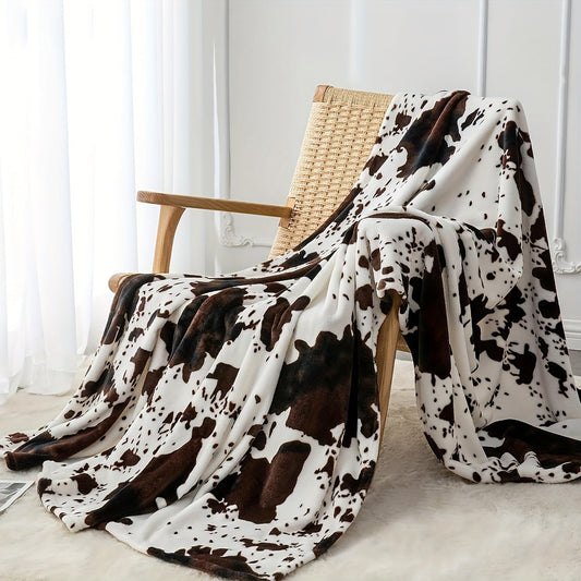 Get cozy with this soft and warm cow print blanket. Perfect for adding a touch of whimsy to your sofa, couch, or bed, this lightweight throw is made from plush flannel fleece. It's a great gift idea for any cow lover and perfect for all seasons.