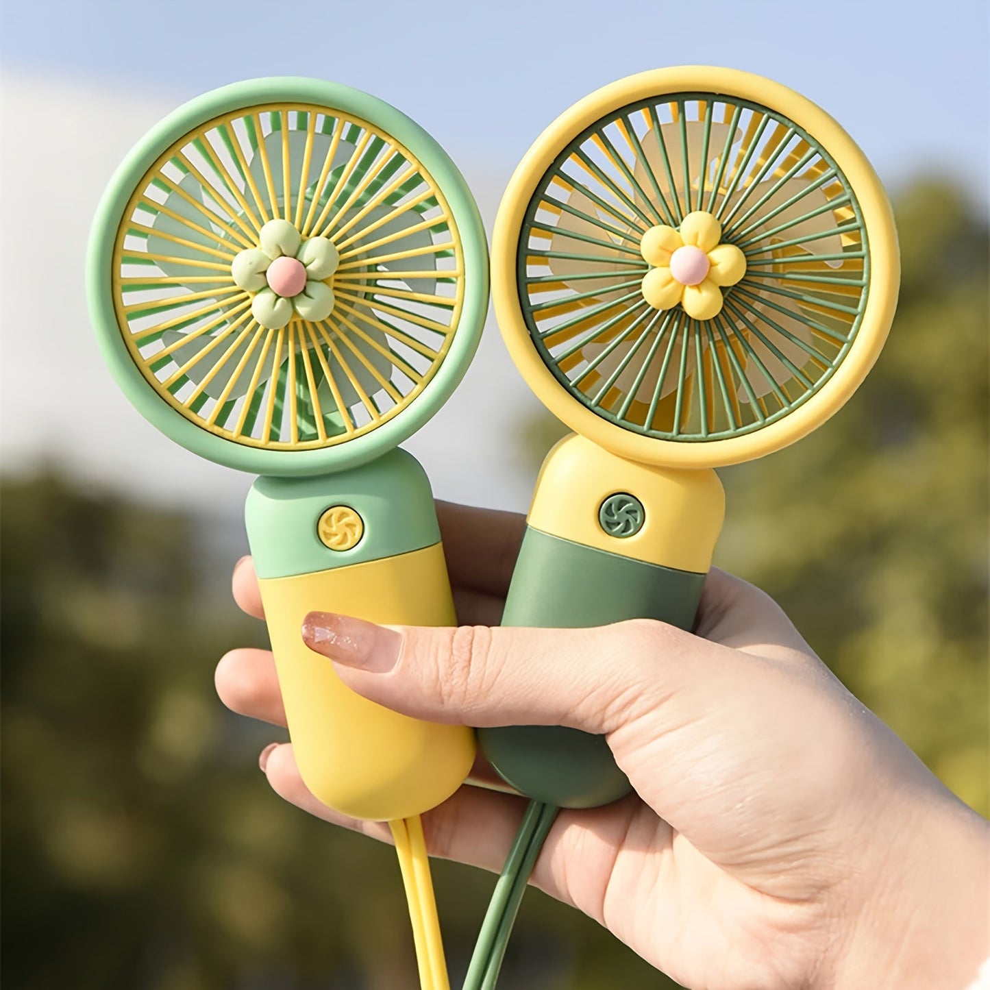 Summer flower color block portable handheld mini fan with USB chargeable feature.