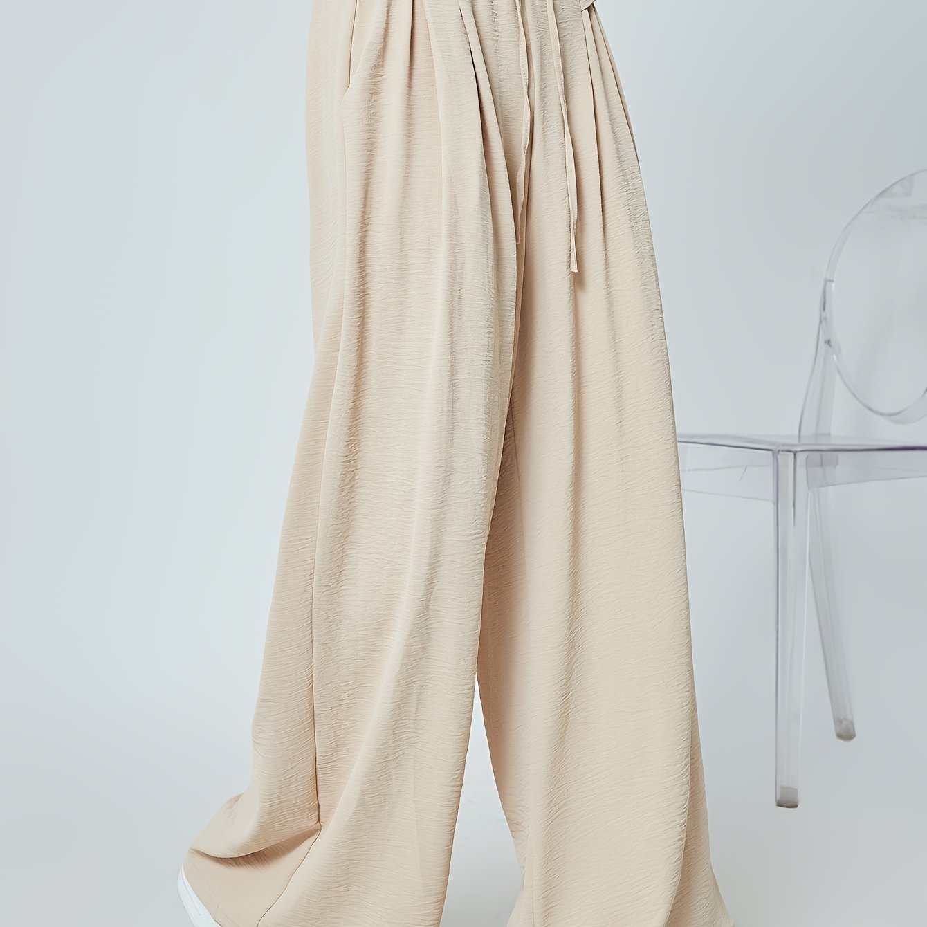 Stylish lounge bottoms with elastic drawstring, pleated detail, and wide leg fit for women's loungewear.