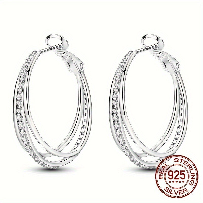 A pair of beautiful Sterling Silver 925 earrings with three hoops, adorned with luxurious zirconia for an elegant and delicate look, perfect for women.