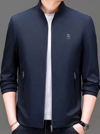 Men's stand collar jacket made from 100% polyester woven fabric in a solid color. Features a regular fit and zipper closure, suitable for spring/fall wear. Fashionable outerwear for