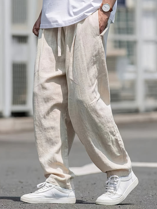 Street style drawstring trousers for men with a loose fit.