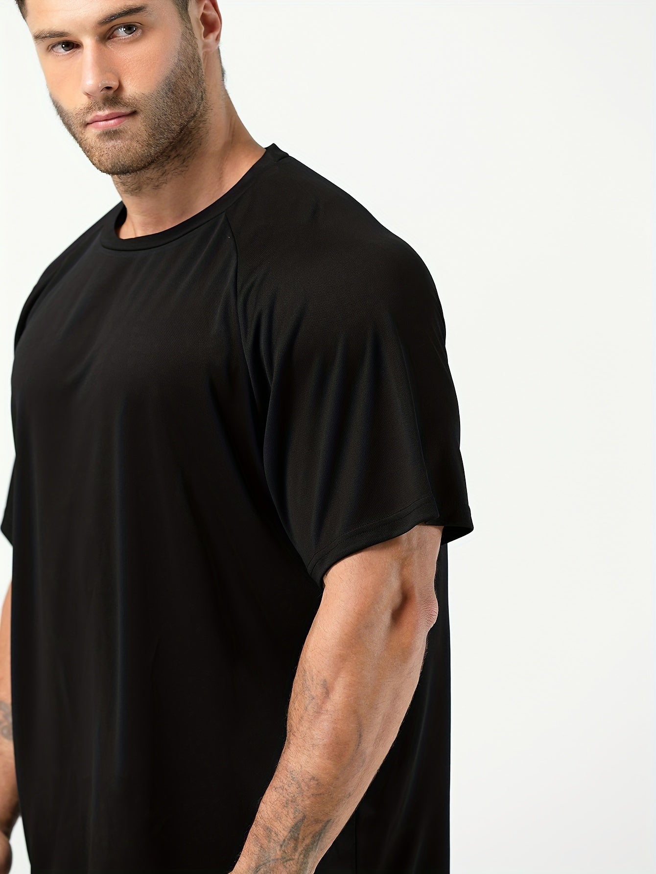 Plus-size men's moisture-wicking short-sleeve T-shirt for casual sports.