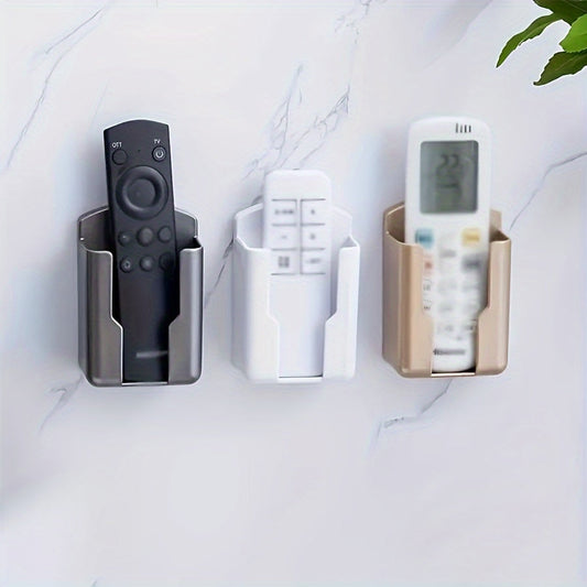 Wall-mounted storage organizer for TV, air conditioner, and remote controls - holds 2 pieces. No-drill adhesive holder for phone chargers and more. Ideal for organizing storage boxes.