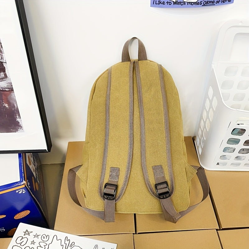 Sturdy canvas backpack with adjustable straps, perfect for school, travel, and work, fits 15-inch laptop.