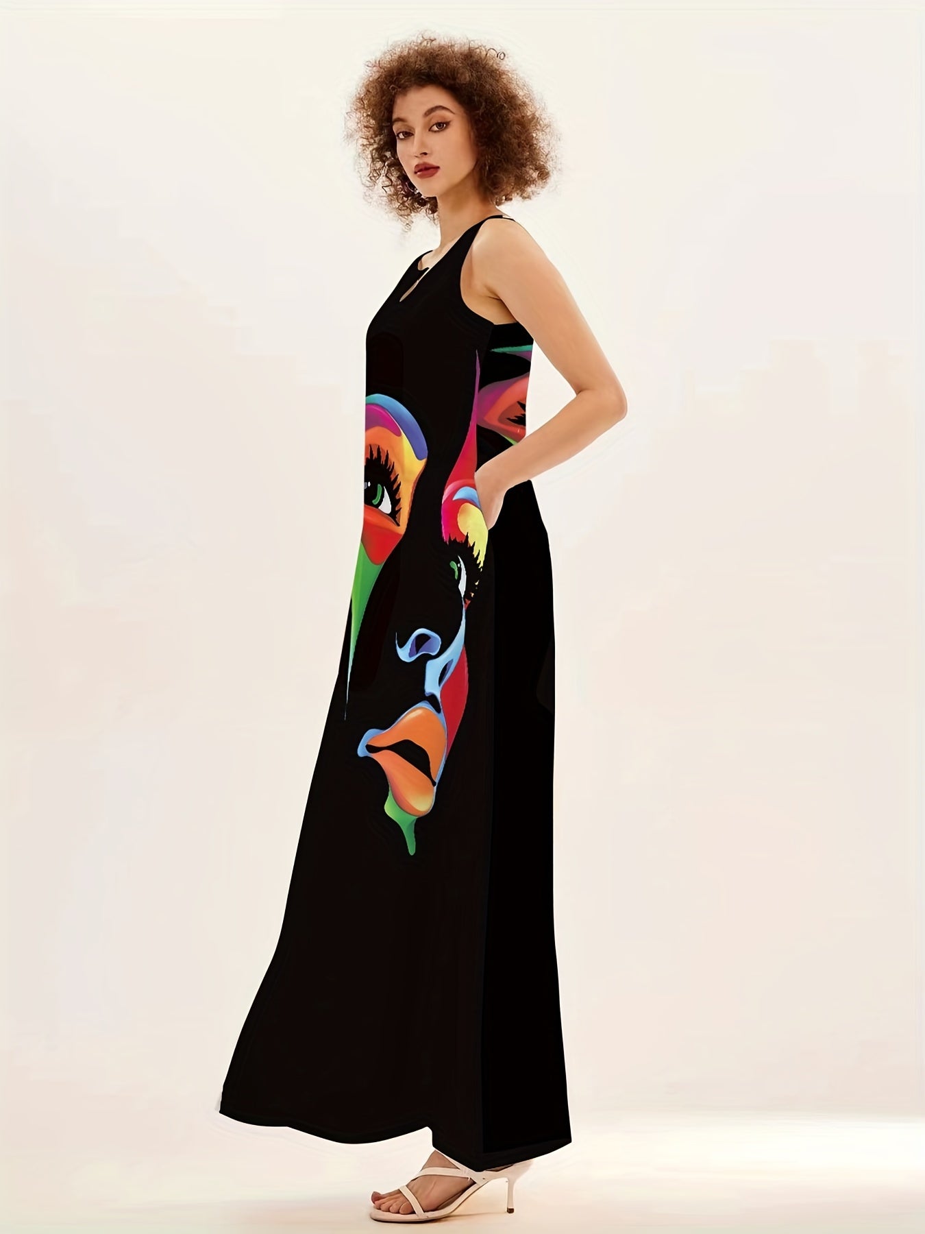 Abstract face print maxi dress with notched neck, sleeveless design perfect for summer and spring wear in women's clothing.