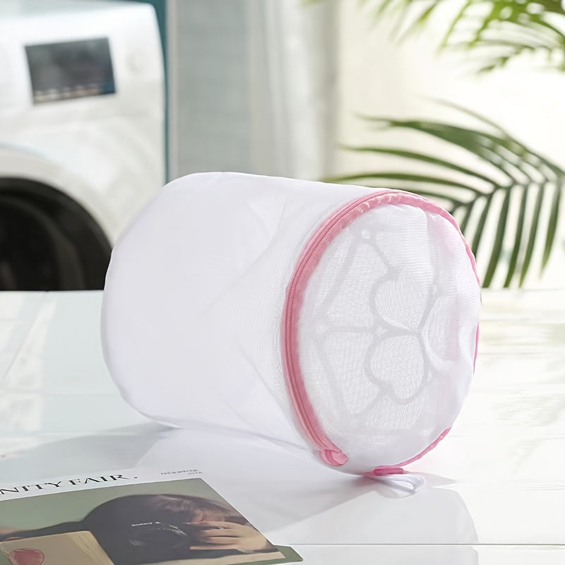 Pink zipper polyester mesh laundry bag, machine wash safe, anti-deformation for delicates and underwear, hexagonal pattern, laundry room accessory.