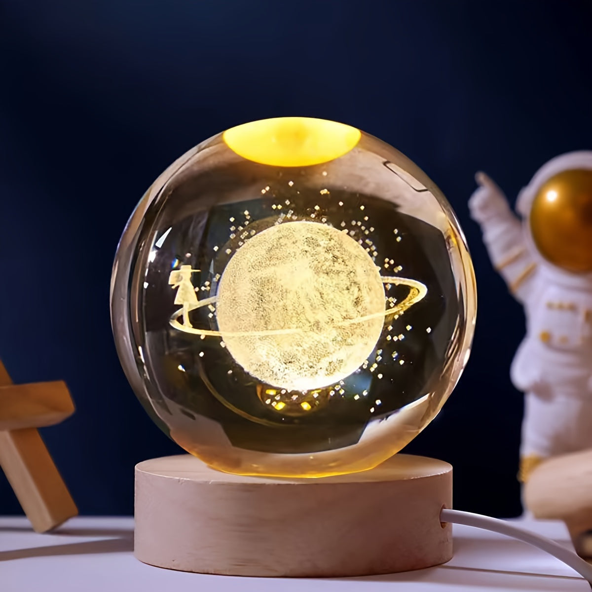 One 3D laser engraved crystal ball night light featuring the solar system and Saturn, powered by USB for home and office decoration, and makes a special gift for Valentine's Day, Christmas, or birthdays.