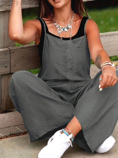 Wide leg jumpsuit with spaghetti straps, sleeveless with pockets, versatile women's clothing.