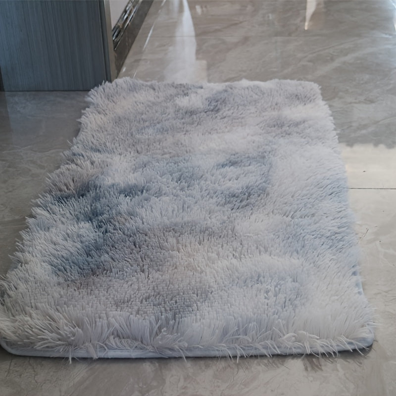 Soft and luxurious light gray plush floor mat with non-slip backing for ultimate comfort and safety. Made of ultra soft, fluffy polyester, this mat is perfect for use in the bedroom, bathroom, or living room. It is machine washable, making it easy to