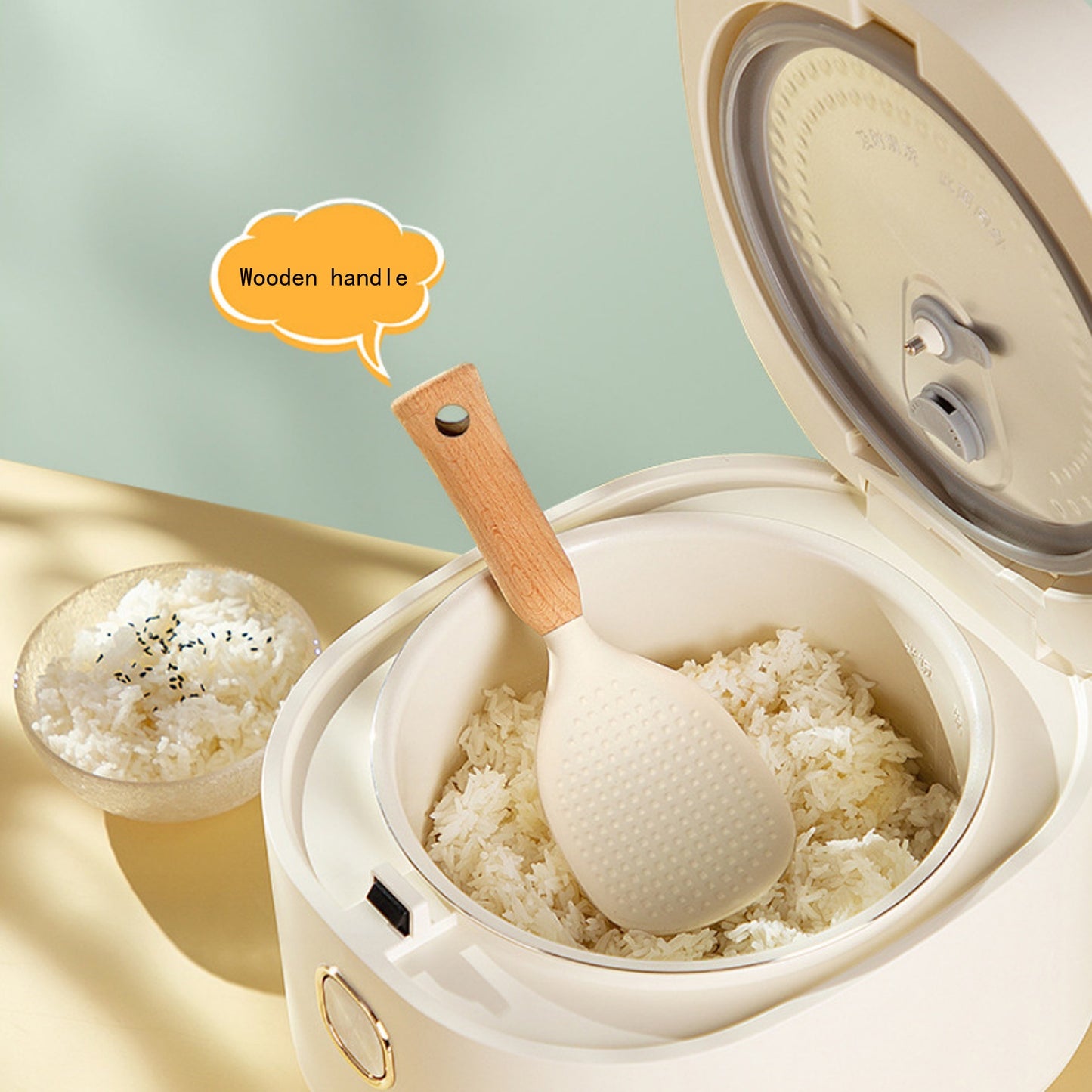 Silicone rice spoon with wooden handle, ideal for non-stick cookware, durable and convenient serving utensil.