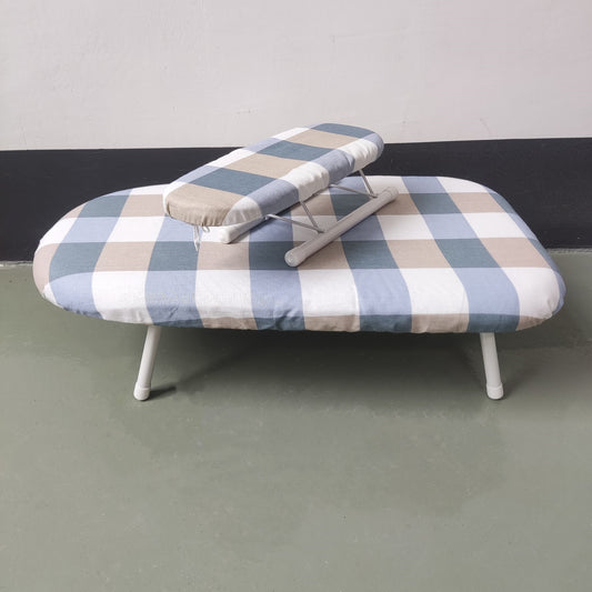 Compact clothes folding board with ironing sleeve, perfect for small spaces and on-the-go use.