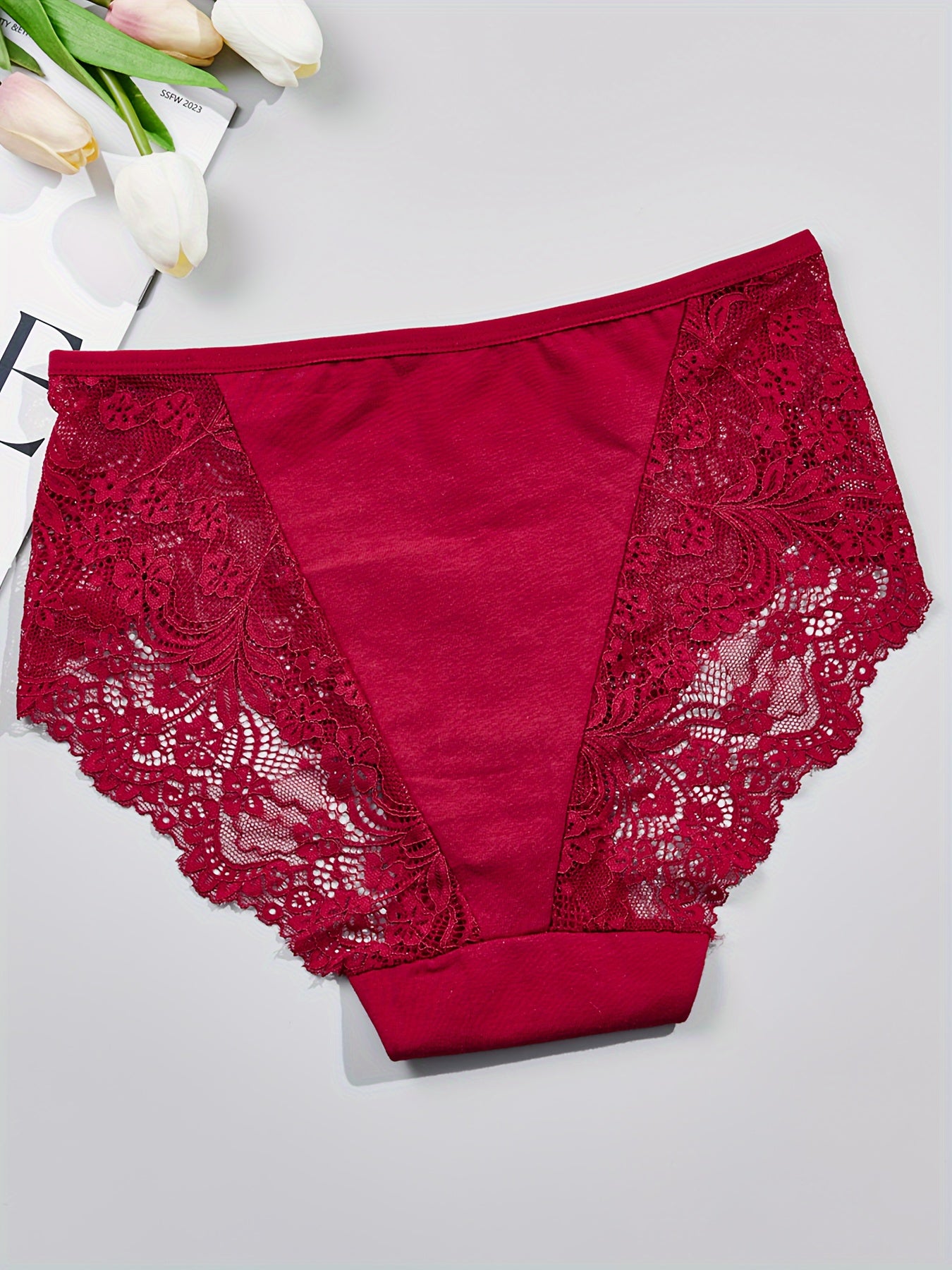 1 pair of women's lace-trimmed brief panties made from soft, breathable nylon blend for everyday wear, sleep, dates, and light sports. Cute and semi-transparent design.