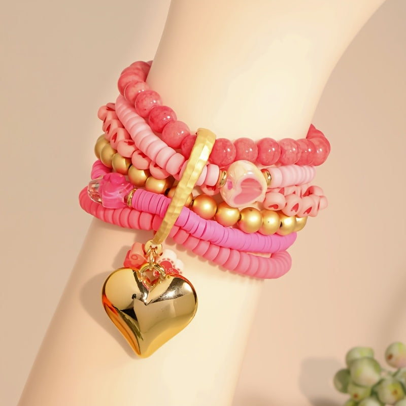 Introducing a versatile Bohemian-style bracelet made of multi-layered pink resin beads, ideal for women looking to elevate their Valentine's Day fashion. Adorned with charming heart inlays, this accessory can be worn for both casual and special