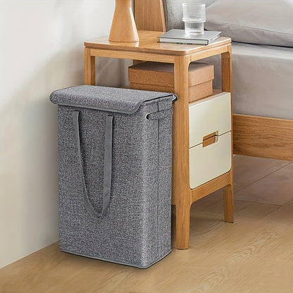 Tall, slim laundry hamper with lid and handles for bathroom, bedroom, or dorm organization. Made of waterproof linen fabric.