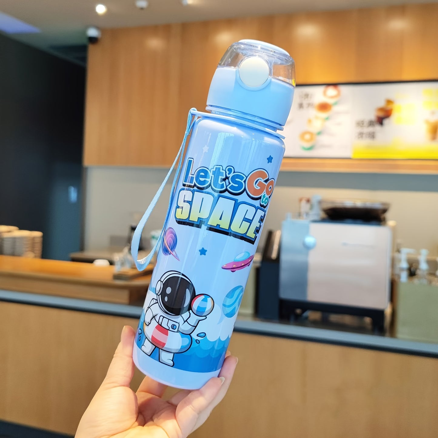 Leak-proof and space-themed 700ml water bottle made from BPA-free, high-temperature resistant PC material, ideal for outdoor activities. A perfect holiday gift.