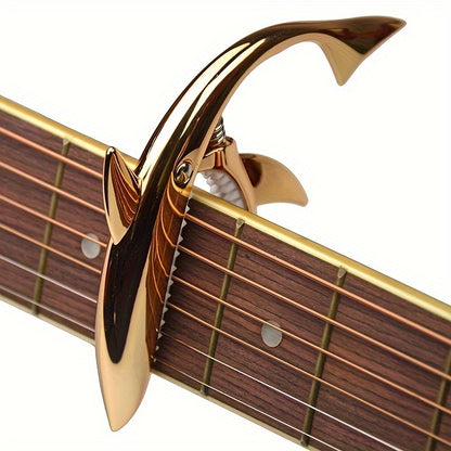 Stylish zinc alloy capo for acoustic and electric guitars, changes pitch.