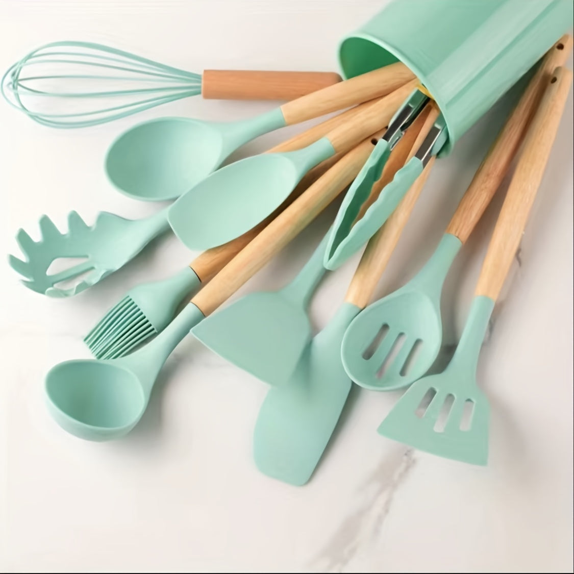 Set of 12 silicone utensils with khaki color and wooden handles, ensuring safety while cooking. These non-stick kitchen tools are washable and modern, providing a range of cookware and gadgets for your kitchen.