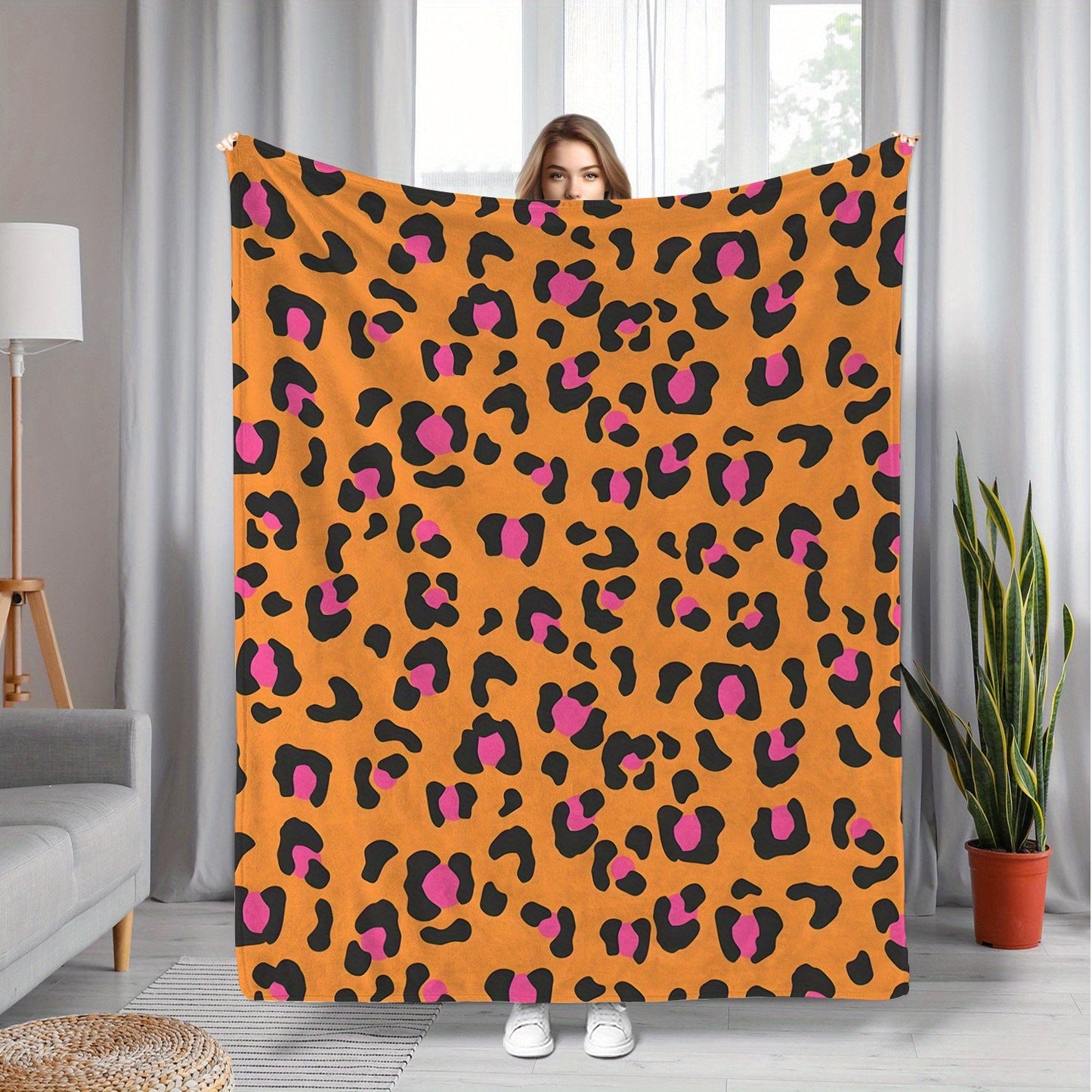 Soft and cozy flannel fleece blanket with a contemporary design. Suitable for all seasons, this blanket is machine washable and features a digital print orange leopard pattern. Made with a polyester cover, this warm plush blanket weighs 200-250gsm and is