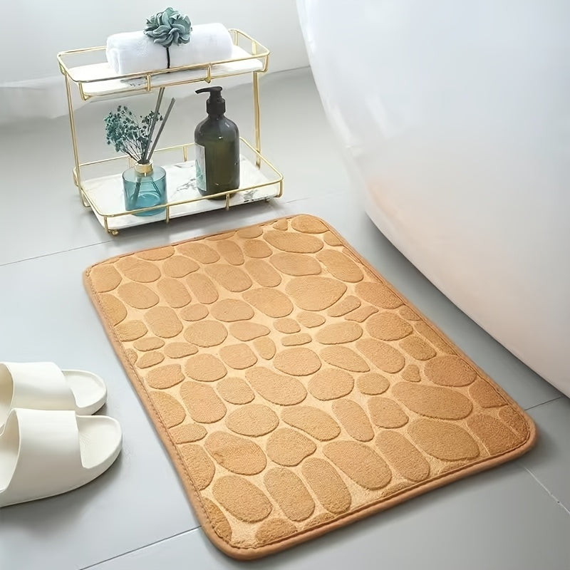 Luxurious red memory foam bath mat with geometric pattern for bathroom floors. Non-slip, soft polyester material that is quick-drying and absorbent. Hand washable, fragrance-free with a textured surface and machine-knit design. Perfect for a quick dry