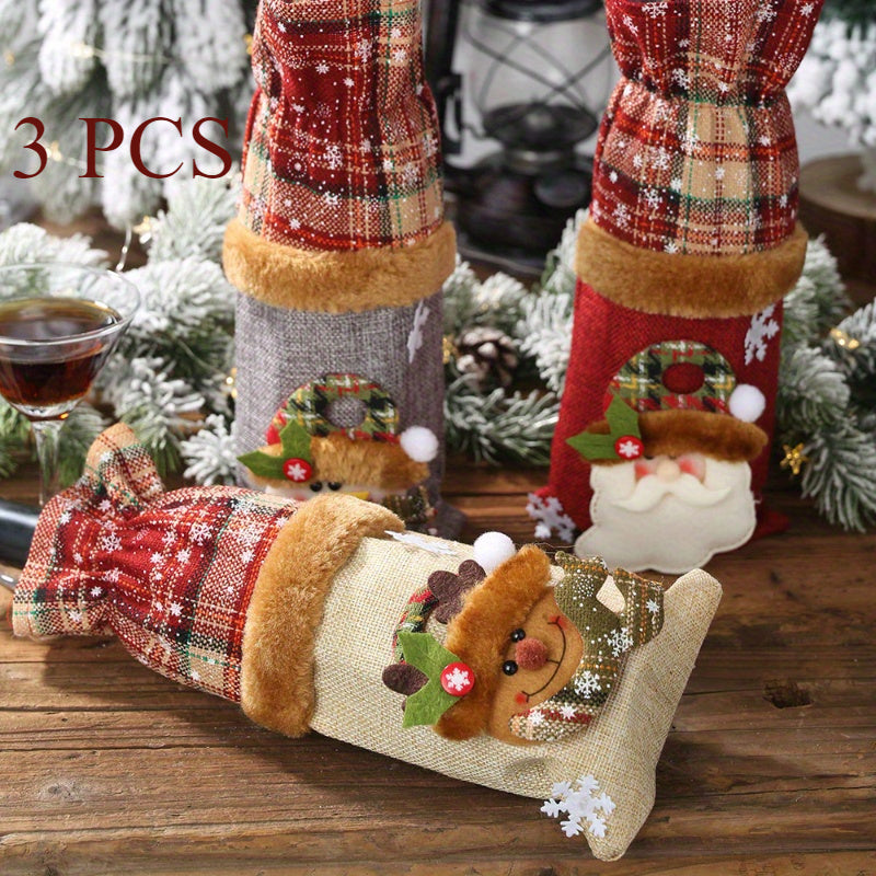 Set of 3 Christmas wine bottle covers in plaid linen with Santa and reindeer design. Hand washable canvas bags for holiday décor and accessories.