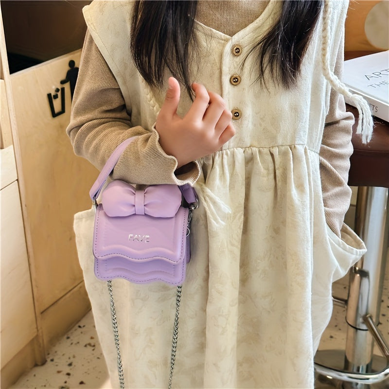 Stylish youngsters' crossbody bag in pink with bow accent and "FAVE" embossed flap. Lightweight, adjustable strap, casual sporty design, easy to clean. Perfect for daily commute.