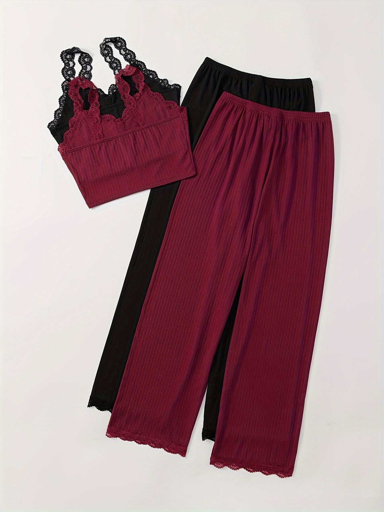 Women's ribbed pajama set with lace detail, V-neck cami top and long pants, machine washable, available in multiple colors.