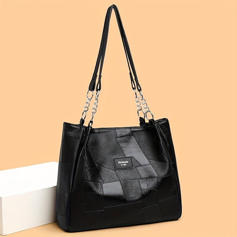 Stylish quilted tote bag with zipper, fixed strap, and classic design, perfect for work or everyday use. Comes in black, white, or brown.