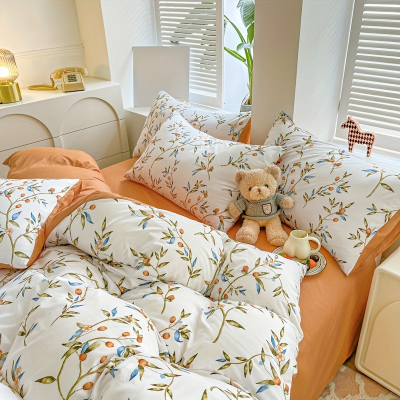 Orange flower and fruit plant pattern quilt cover set includes 1 quilt cover and 2 pillowcases in a pastoral style. Made from comfortable and skin-friendly material, it is non-ball and can be machine washed. Available in single, double, standard, and