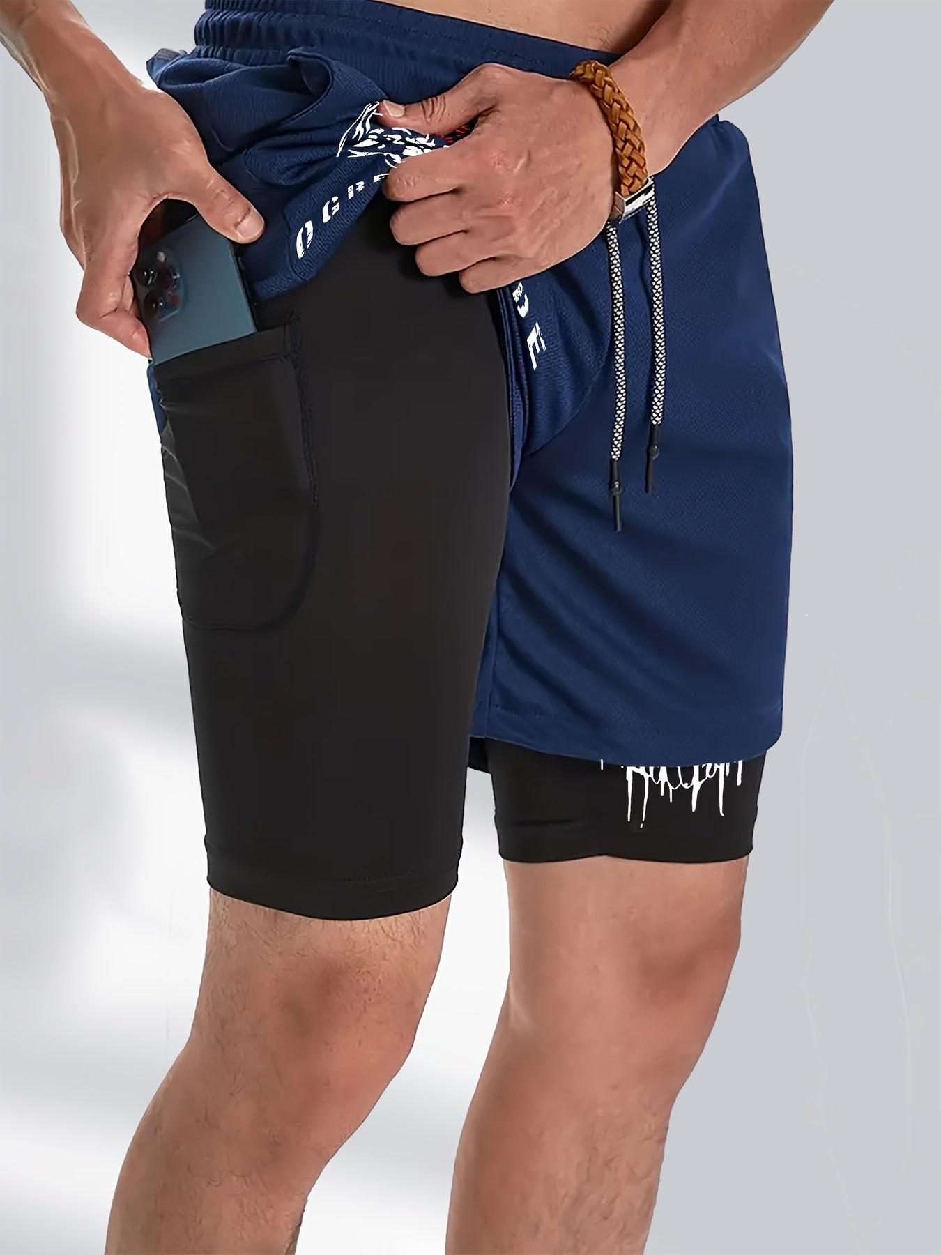 Men's 2-piece sportswear set: Quick-dry compression t-shirt with print design and crew neck, paired with multi-pocket running shorts made of breathable knit fabric.