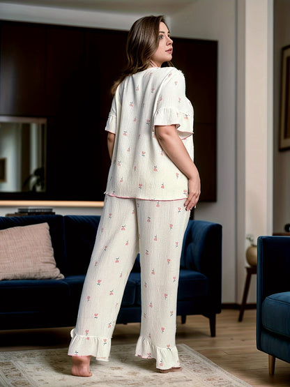 Women's printed pajama set with long pants and short sleeves in large size.