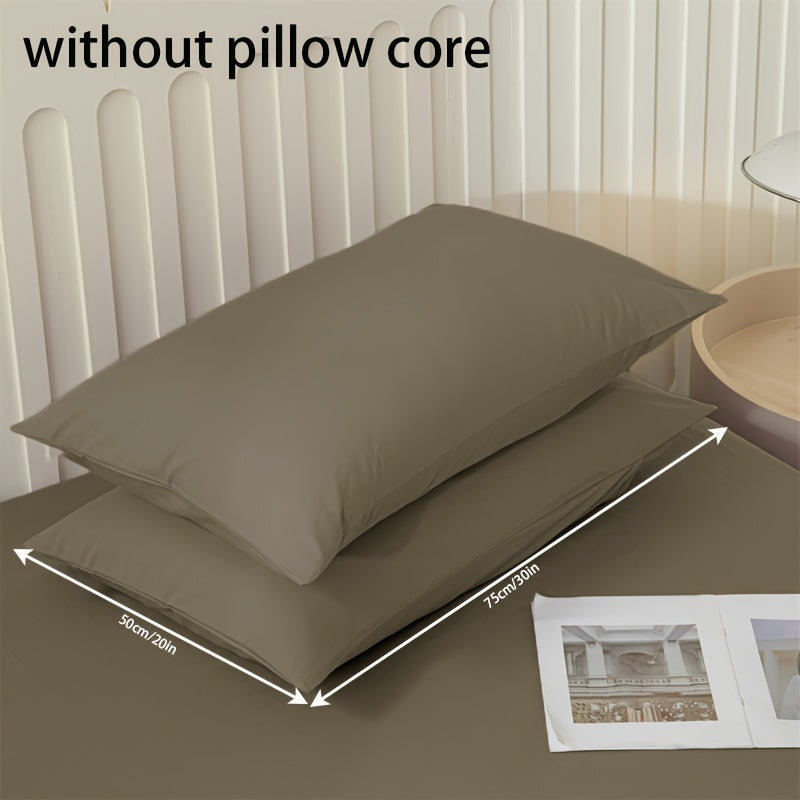 Get two ultra-soft brushed polyester pillowcases, weighing 90g each in a sleek light purple color. These rectangular pillowcases measure 50.8x76.2cm and feature an envelope closure. They are machine washable and perfect for adding cozy comfort to your