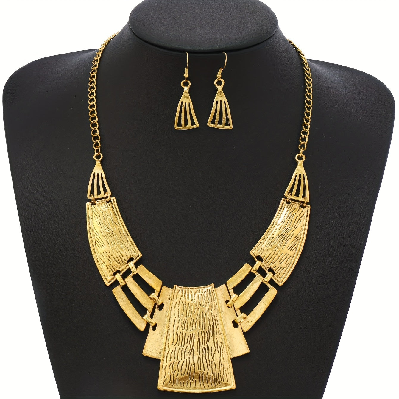 Vintage Jewelry Set includes 3 pairs of earrings and a necklace, featuring a geometric design in either silvery or golden tones. Choose the one that suits your style and make a stunning statement with these party accessories.