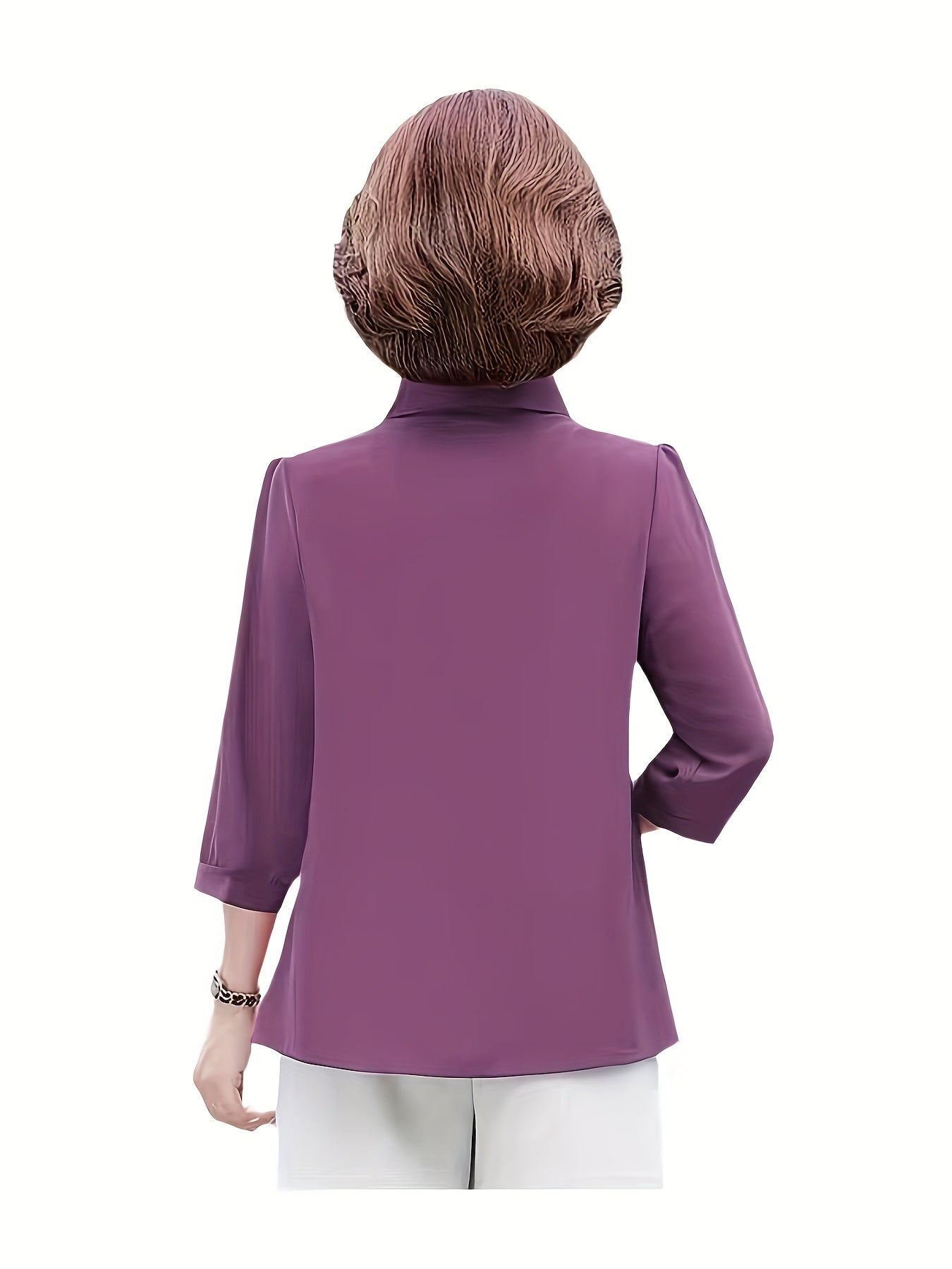 Stylish purple chiffon blouse for women with 3/4 sleeves, slimming fit, and decorative buttons. Made of lightweight polyester-elastane blend, perfect for spring, summer, and fall. Features