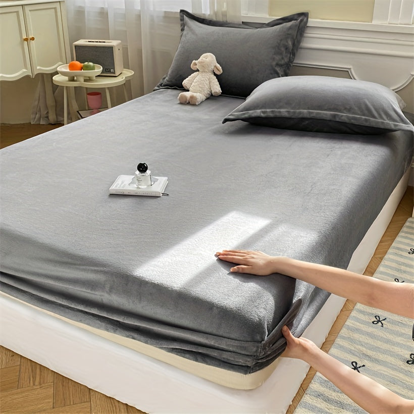 Indulge in the opulence of our Luxurious Plush Fitted Sheet, crafted from ultra-soft milk velvet for a cozy and warm feel. This easy-care sheet is machine washable and features a light gray hue with a deep pocket design for a perfect fit. Ideal for